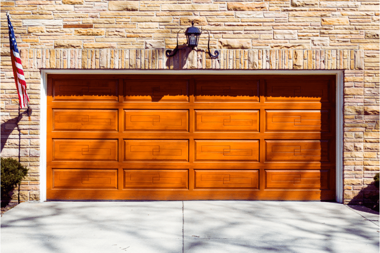 A brown garage door showcasing modern design trends and architectural compatibility.